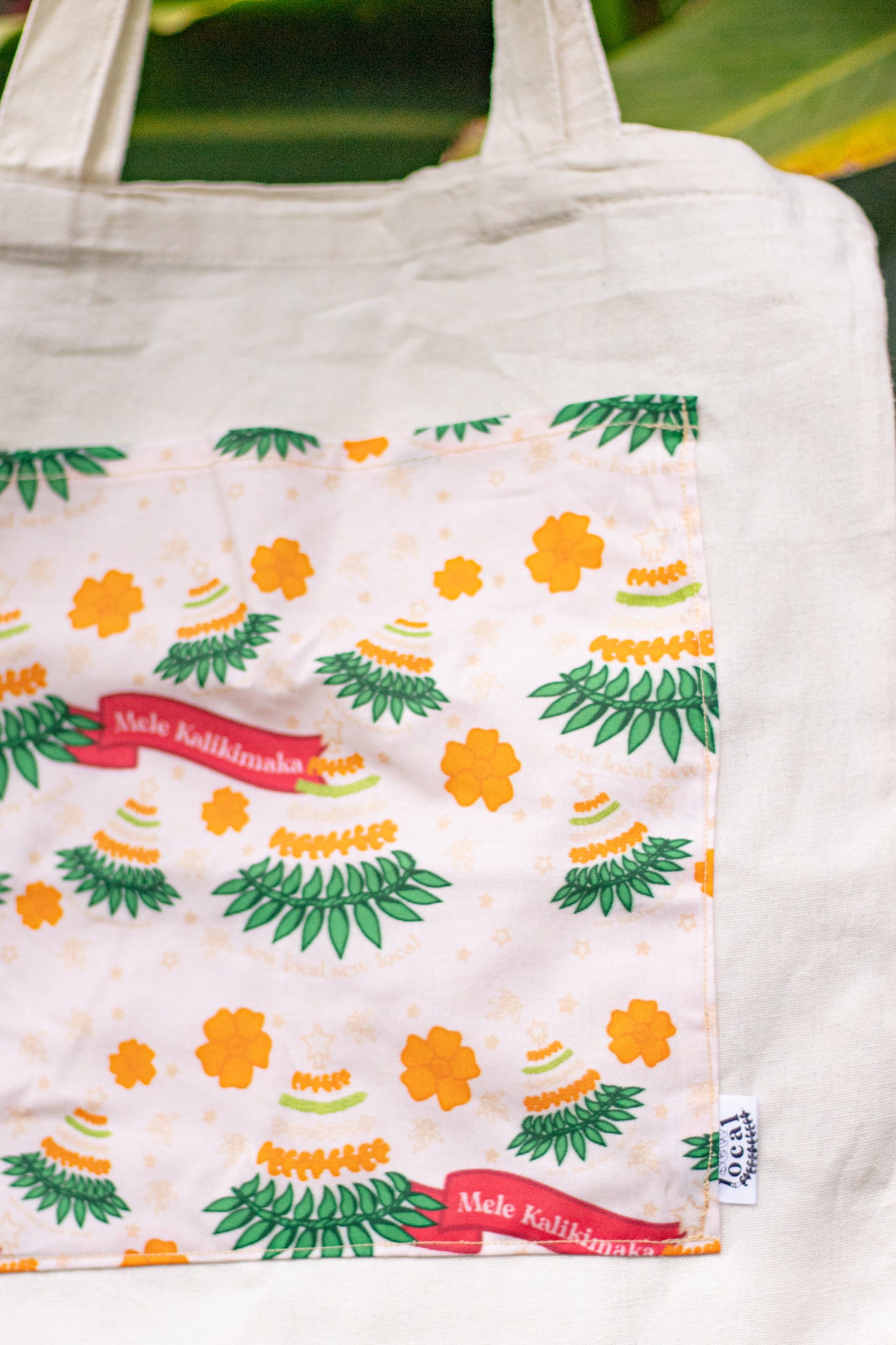 Mele- Mele Kalikimaka Pocket Tote Bag